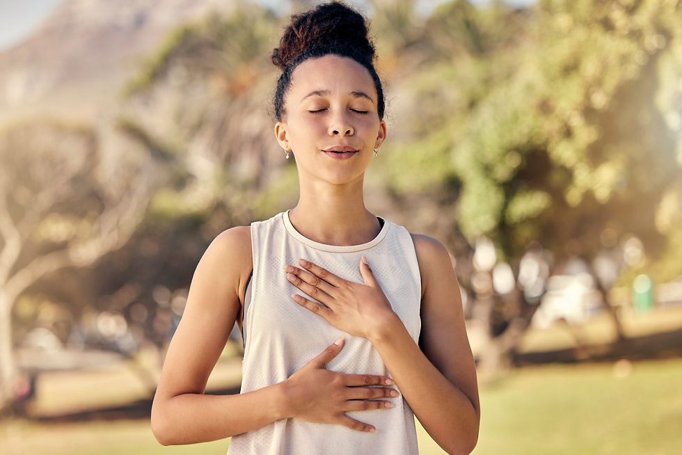 Woman breathing with hands on chest area