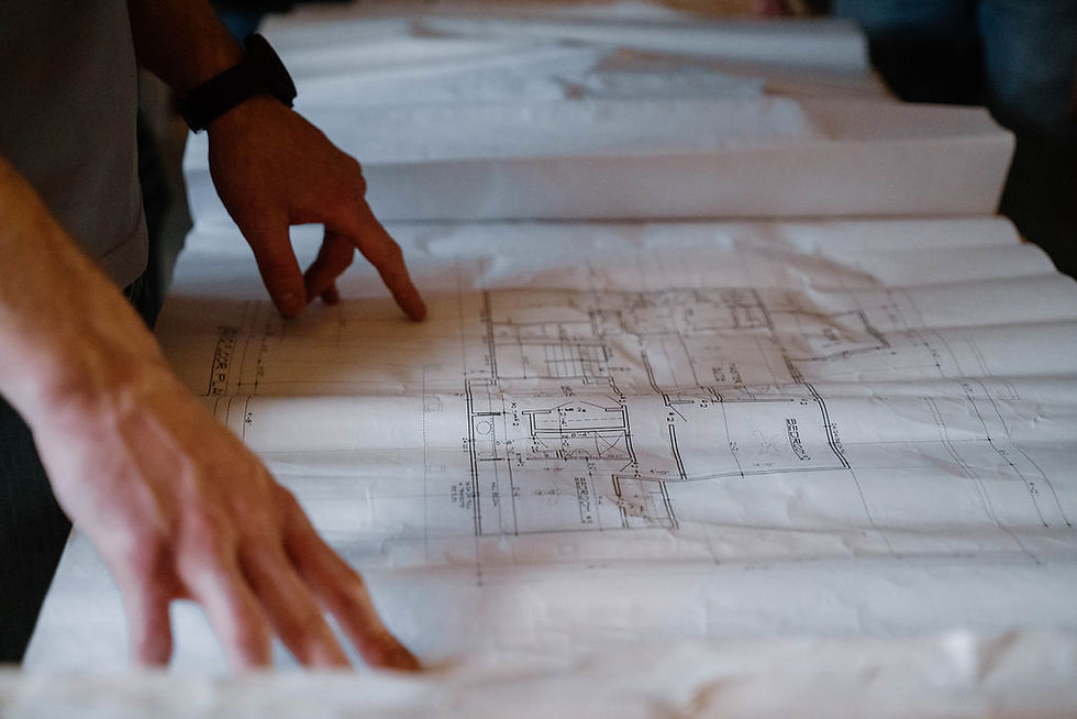 General Contractor Looking over Home Drawings