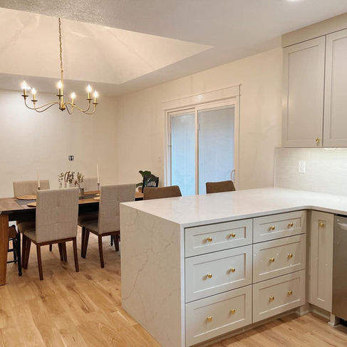 kitchen design with natural light, tile backsplash, and updated stainless steel appliances in Johnson County home