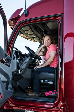 portrait-of-a-caucasian-woman-driver-and-her-comme-ATRZDEN.webp