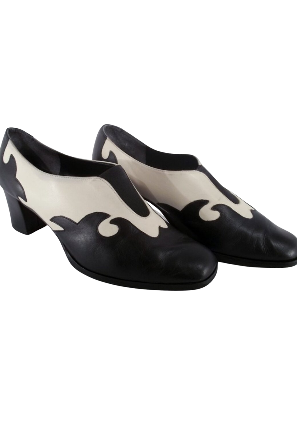 Pair of black and white leather pumps, wavy design, high heels.