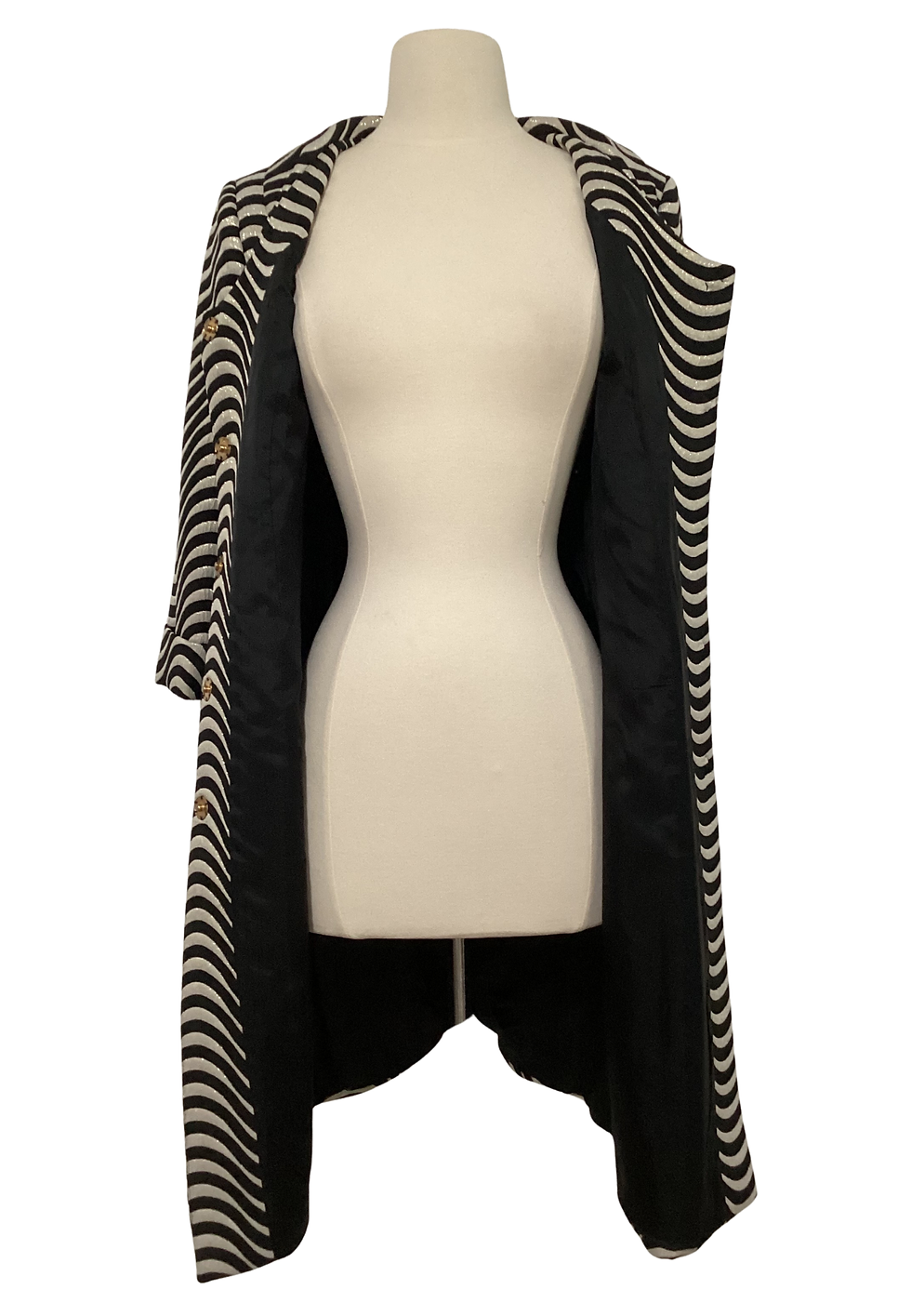 Thumbnail: Open striped coat on a mannequin with black lining and gold buttons.