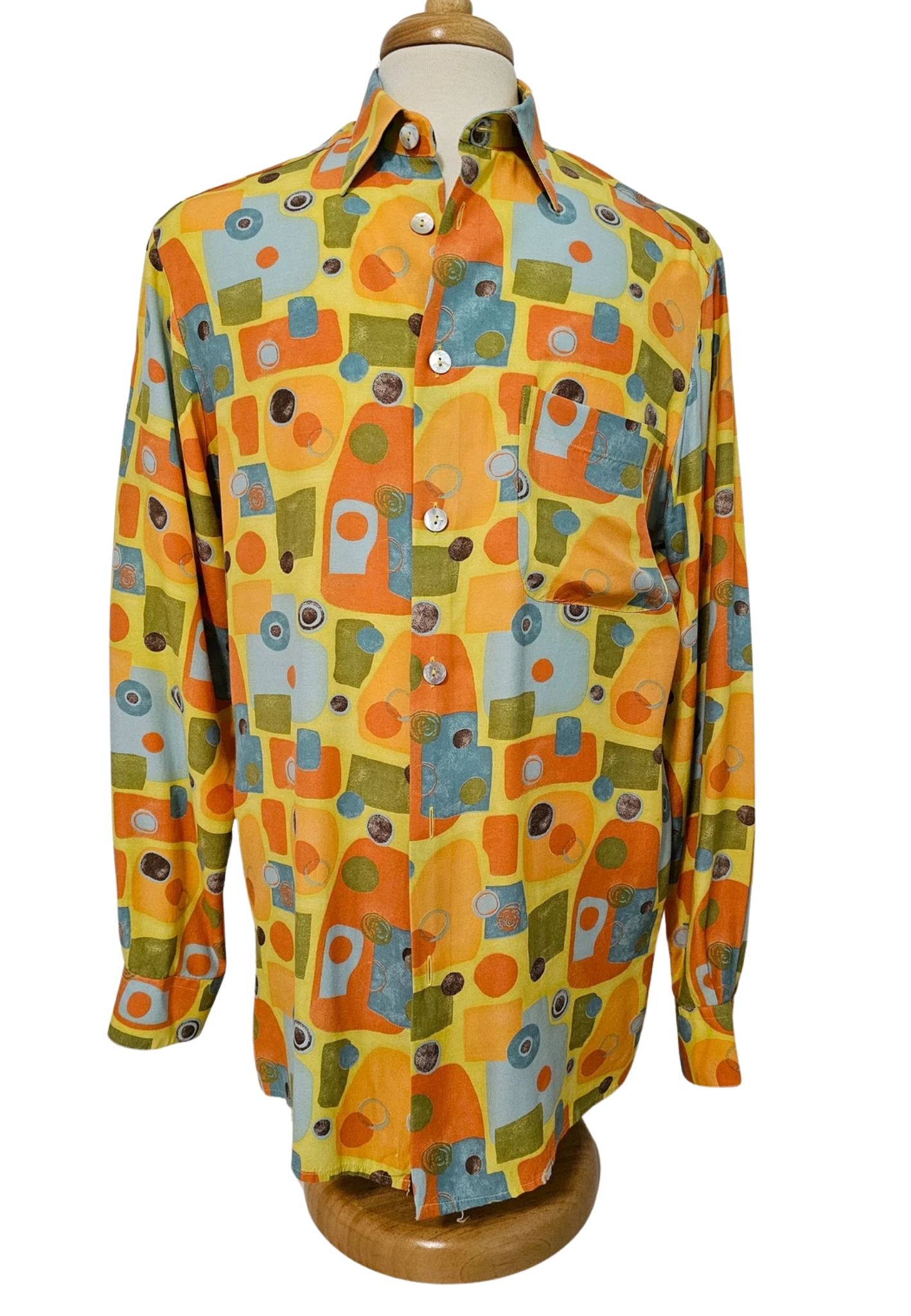 Colorful patterned button-up shirt isolated on white background, vintage style.