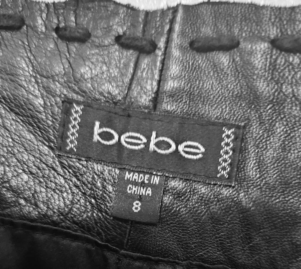 Thumbnail: Close-up of a bebe label, Made in China, size 8, attached to garment