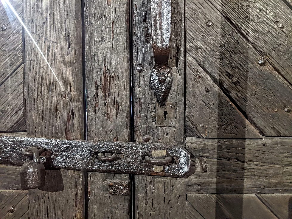 old wooden door with metal lock