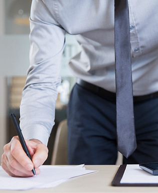 successful-businessman-signing-contract-