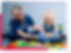 women providing autism therapytreatment to a kid