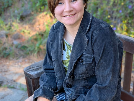 Ally sitting on a bench