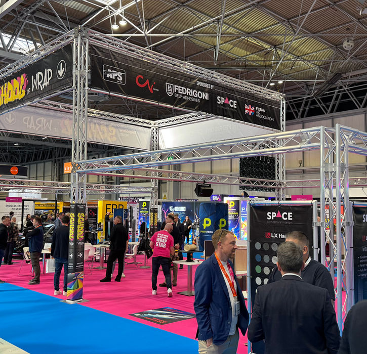 Wide view of branded exhibition truss structure at The Sign Show 2025 at NEC Birmingham