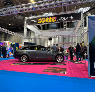 Angled view of open-frame exhibition stand with truss structure at The Sign Show 2025