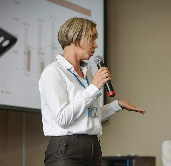 Speaker using handheld microphone during a business presentation