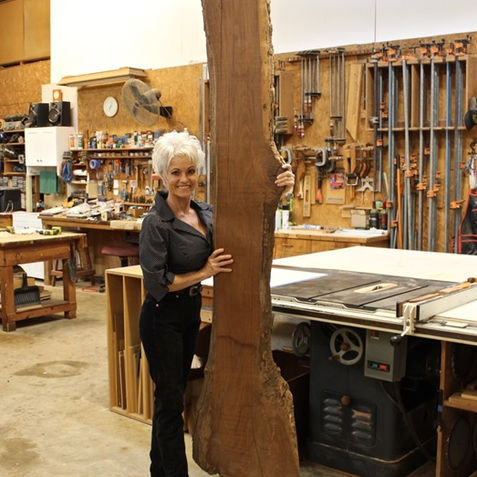 TAYLOR - Holding big slab of Walnut.jpeg