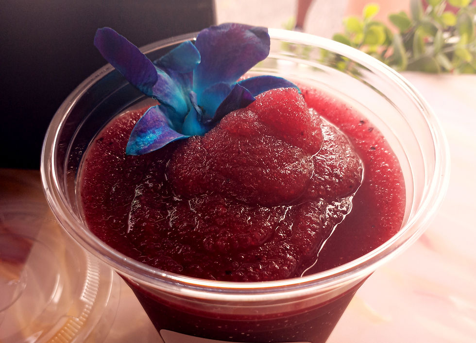 Classic slushy flavor "All Berry" served with a beautiful blue orchid flower that mimics the fresh blueberry ingredient.