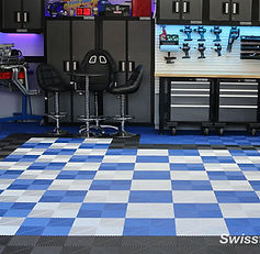 SwissTrax modular garage floor tiles in blue and gray design with black border