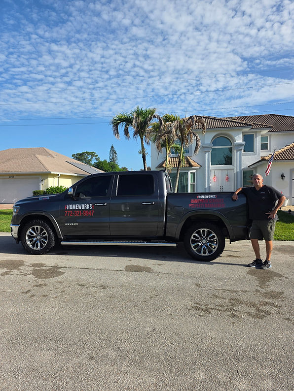 Bobby Shashaty, the owner of Homeworks Handyman Services in Vero Beach standing in front of his company truck