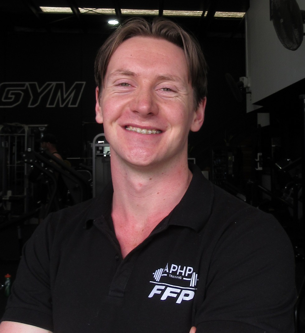 Smiling Gus Price "personal trainer" in a gym