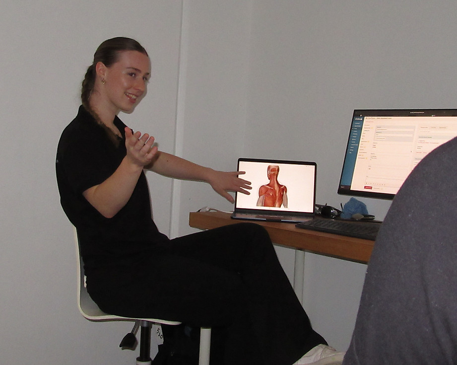 Practitioner explaining anatomy for personal training, massage therapy in Gisborne, Victoria.