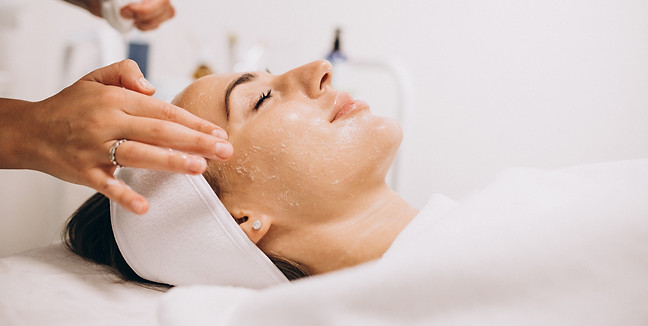 cosmetologist-cleaning-face-woman-beauty-salon.jpg