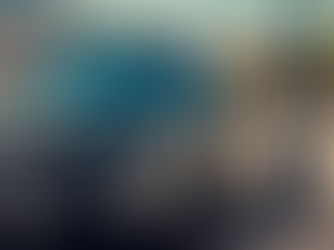 Peugeot E-3008 in workshop at Cars 13 garage in Marseille, mechanic working on electric diagnostics. Visible tools, lift, and high-voltage signage. Friendly atmosphere, high-quality equipment, clean and professional environment. Carrosserie, révision, pneus signage in French in the background. Daylight, documentary-style photography.