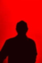 Black figure on red background