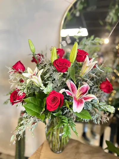 Tall and Elegant with Fragrant Lilies and a dozen long stem roses elegantly designed with 
