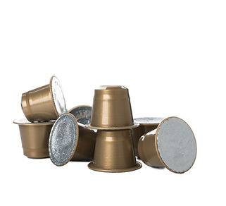 png-golden-coffee-capsules-with-foil-isolated-white-background.jpg
