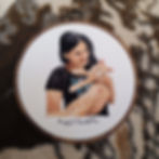 Cat Woman cat lady hand-stitching a bespoke embroidery piece