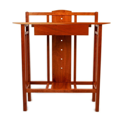 One of our signature pieces that displays a fusion of stylistic influences from “Arts and Crafts” to Japanese and Danish Modern.   The integral Walnut drawer glides are one example of how Form and Function became best friends.