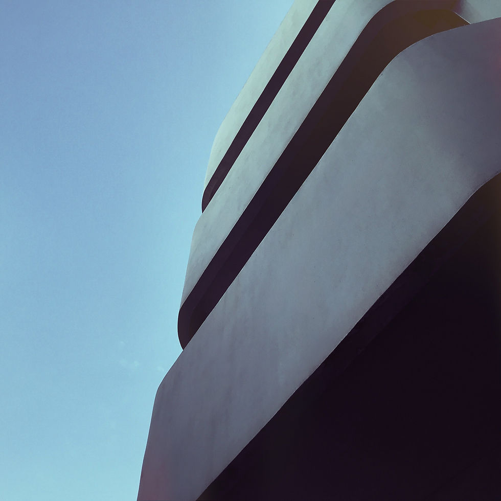 Curved Bauhaus 2 architecture against a clear blue sky