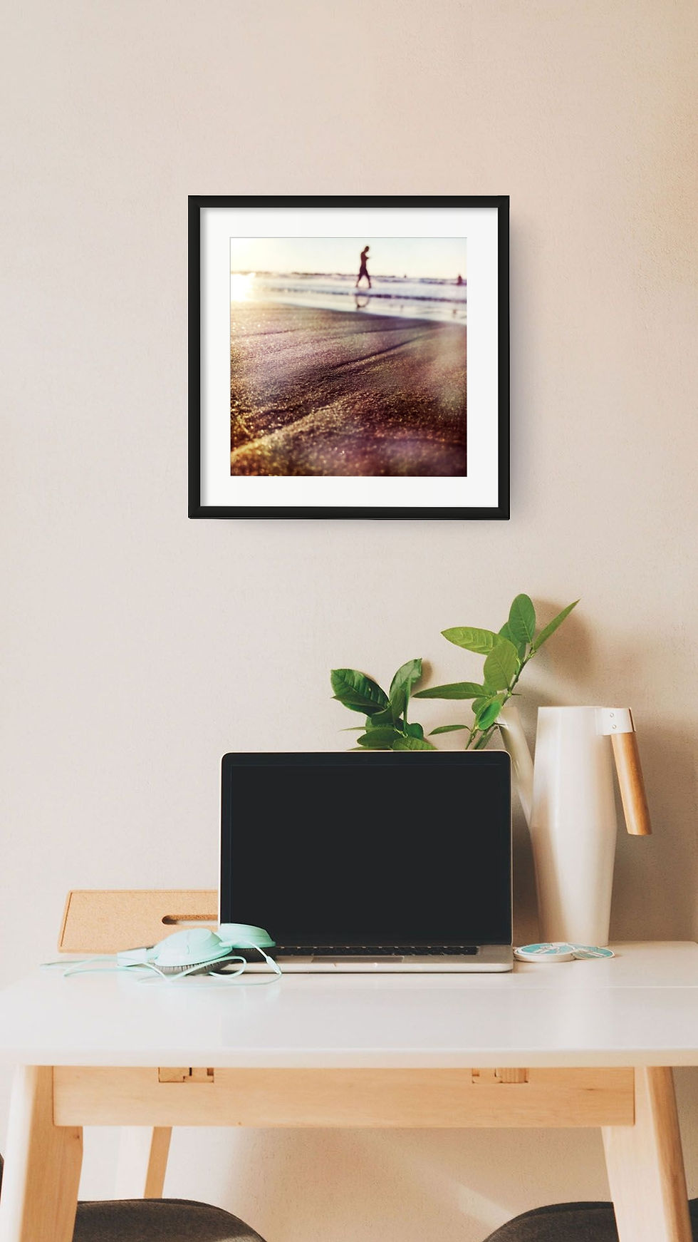 Framed Gordon landscape print above a home office desk.
