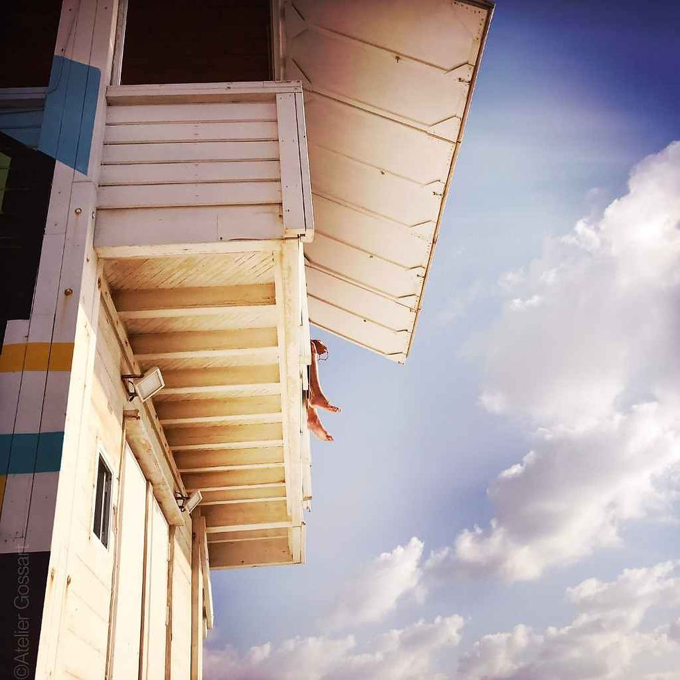 Lifeguard tower on duty at the beach under a sunny sky