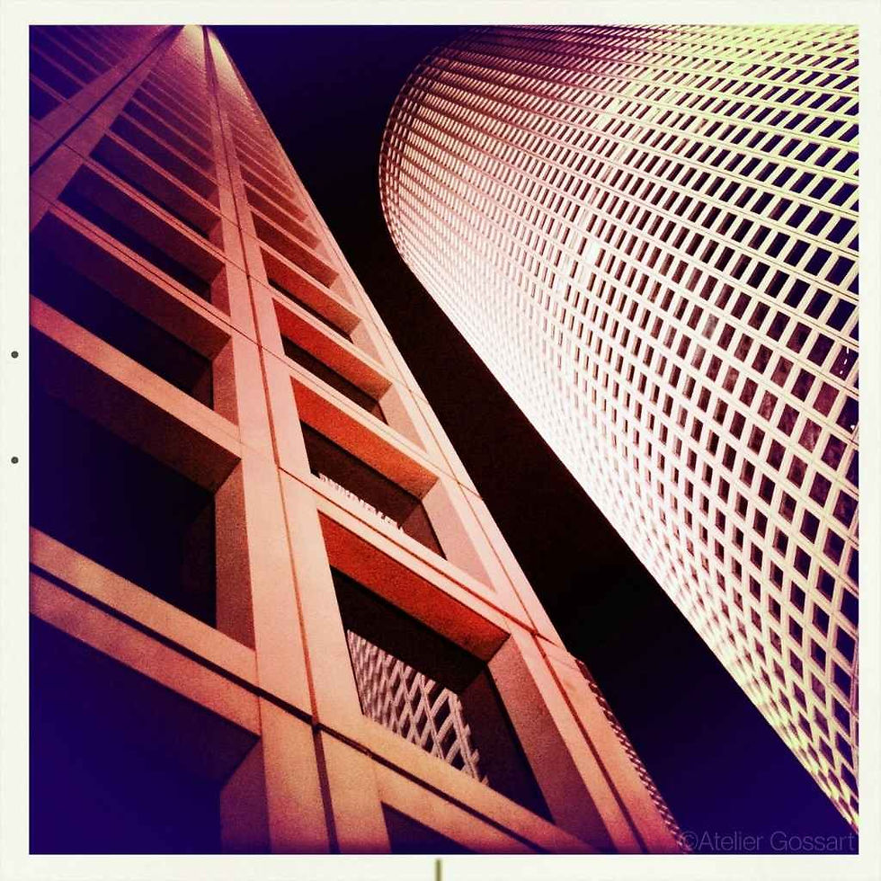 Modern Azrieli Center towers seen from a low angle