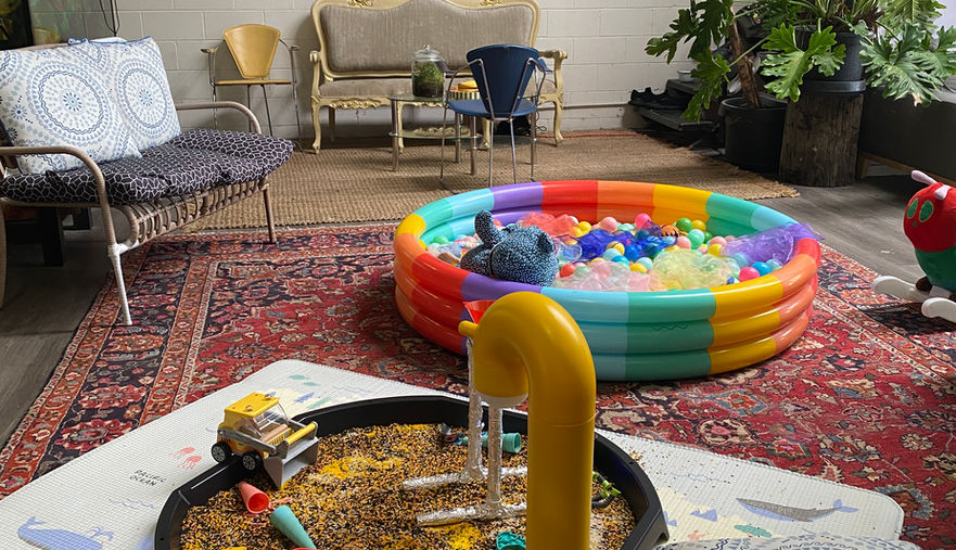 ball pool and rice sensory tray during an indoor messy play session at Lemontree Kids in Byron Bay.
