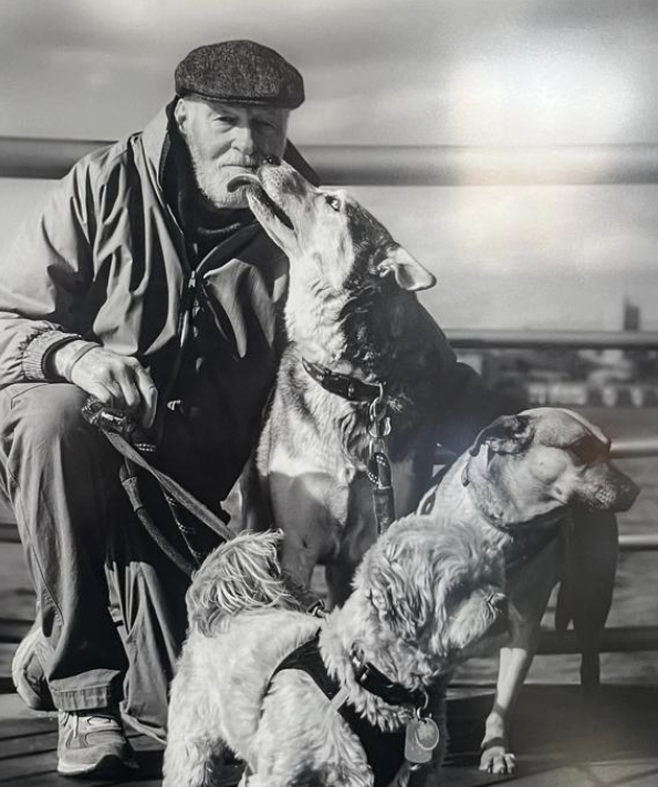 Dave with the dogs they already had (Moose, Squirrel, & Dickens) when they started rescueing pets in need.