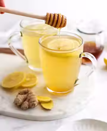 Warm honey lemon and ginger tea as a soothing drink during cold and flu season.