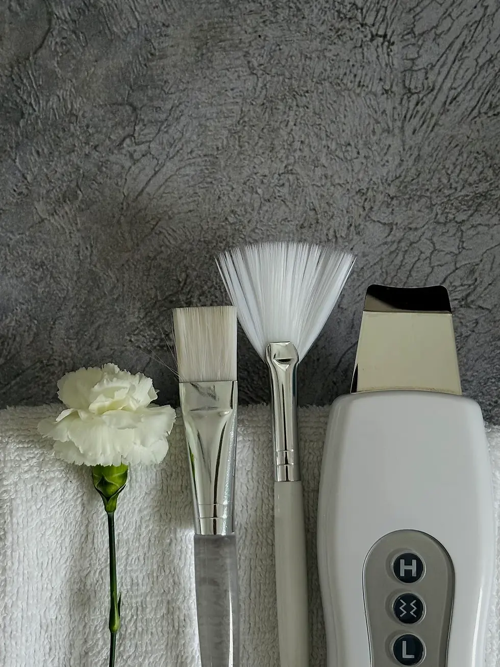 Professional facial tools and ultrasonic skin treatment device used for acne care in London Ontario