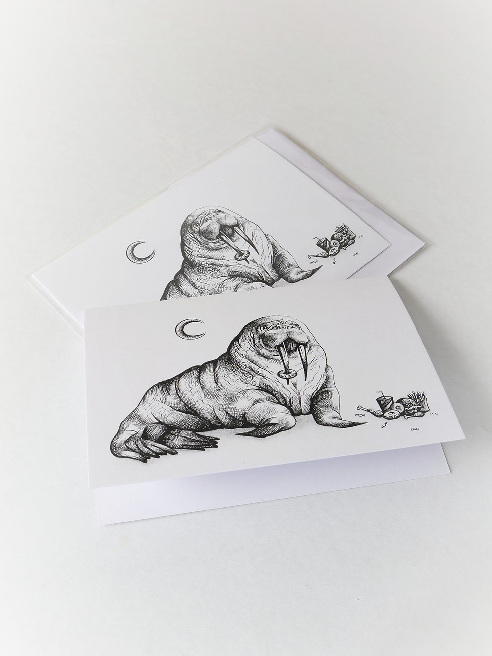 A greetings card created by New Zealand Artist Mikayla Forster. The card depicts a walrus with food