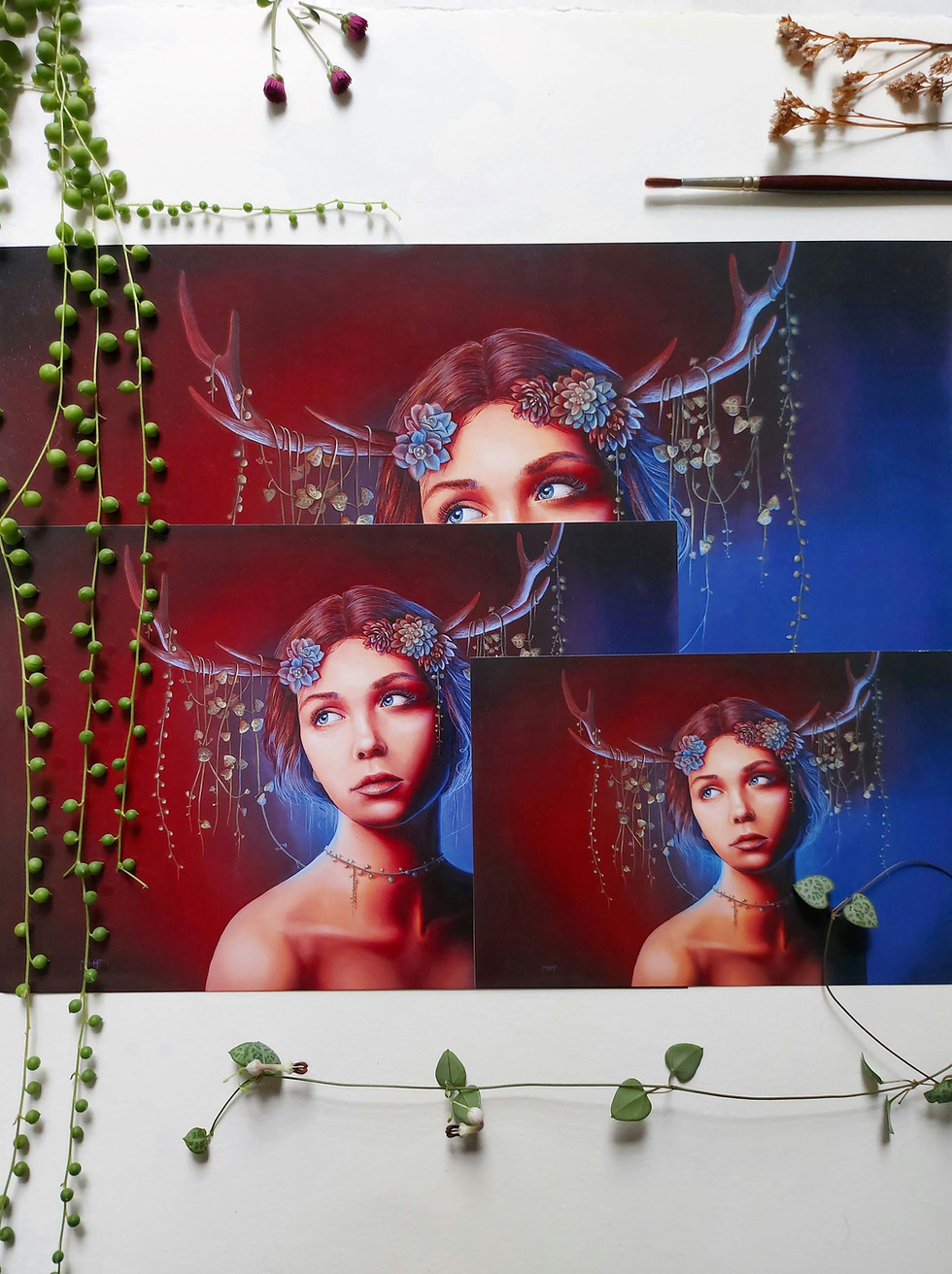 A photograph of fine art prints by New Zealand artist Mikayla Forster. This art print depicts a female portrait with flowers