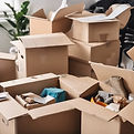 moving boxes being packed with things in an organised way.jpg