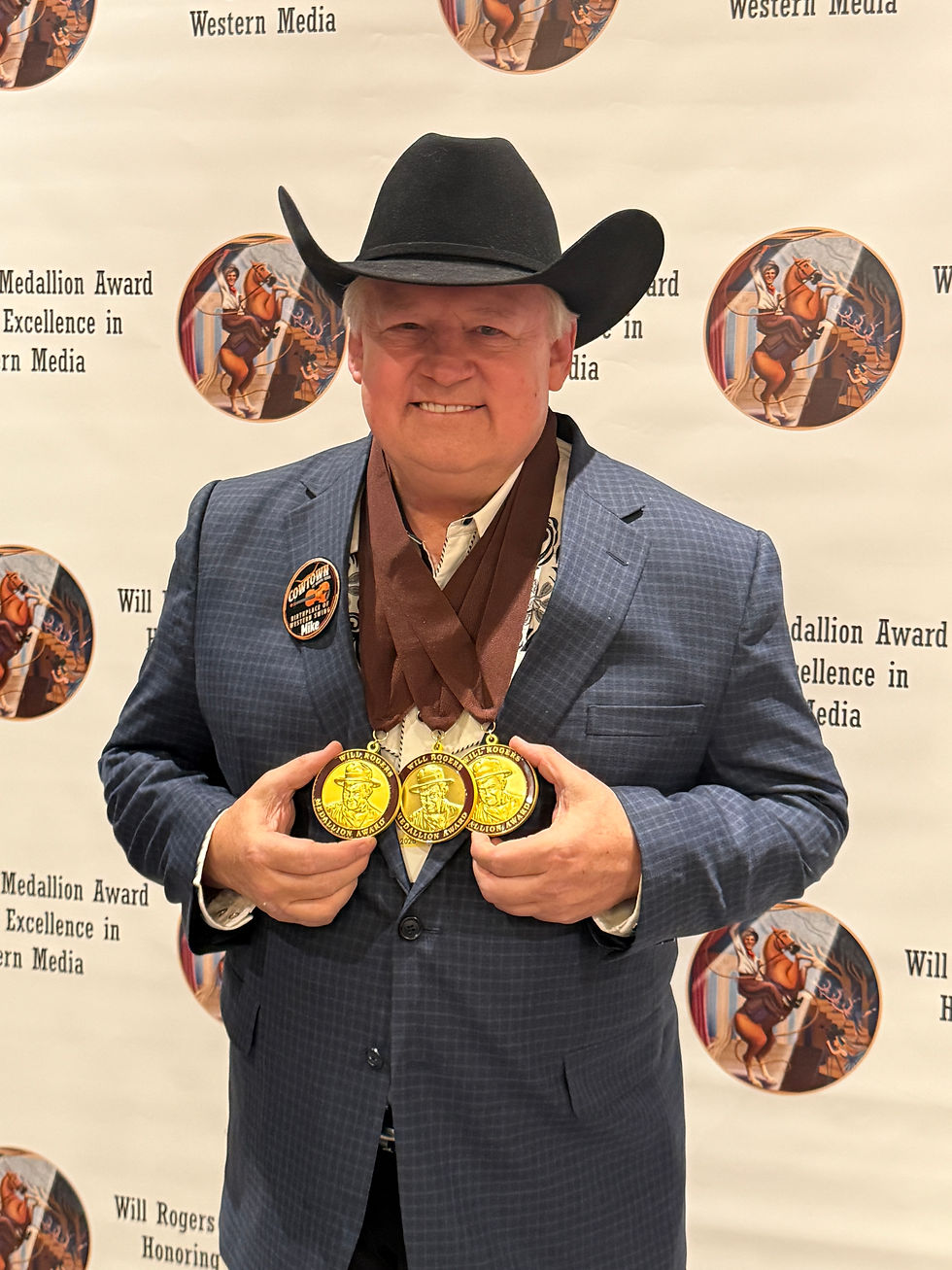 Michael Markwardt with his three Will Rogers Medallion awards.