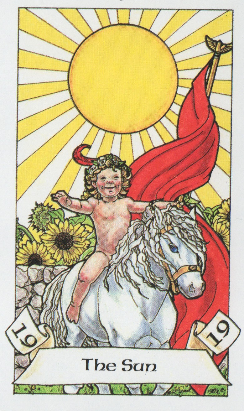 The Sun tarot card from the Robin Wood deck showing a joyful child riding a white horse beneath the sun.