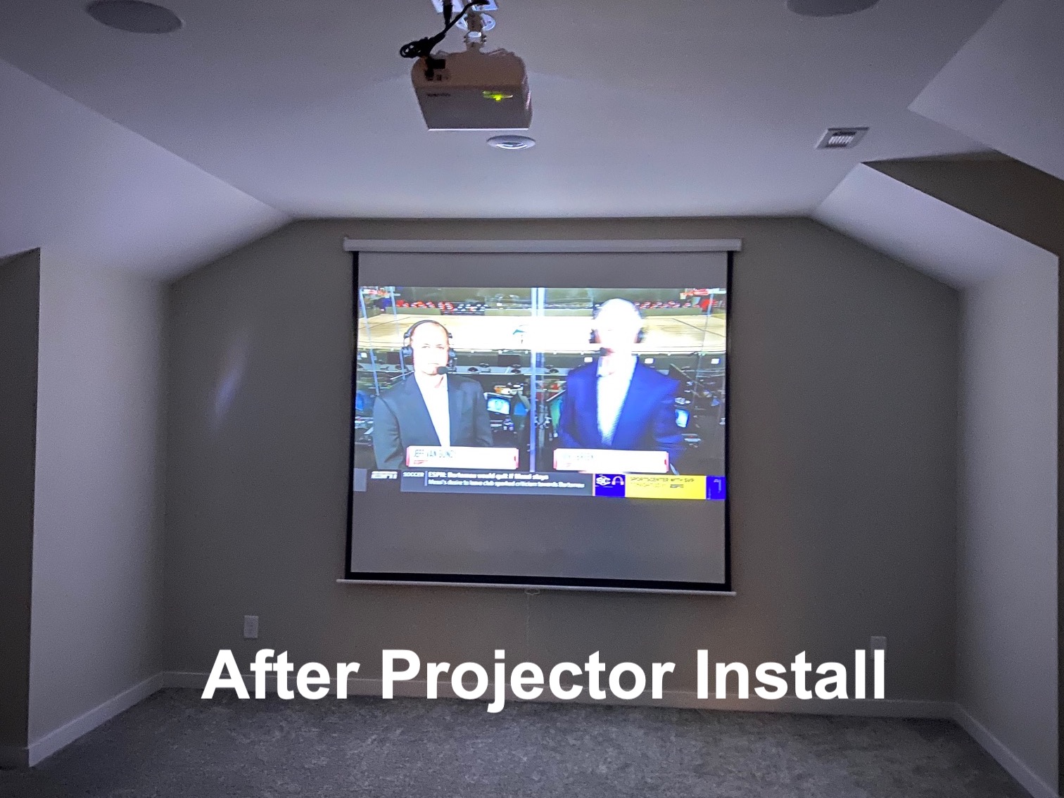 Projector and drop-down screen installed in a bonus room by Anything Electronics