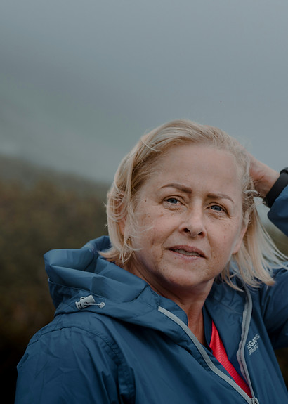 Middle aged woman in raincoat