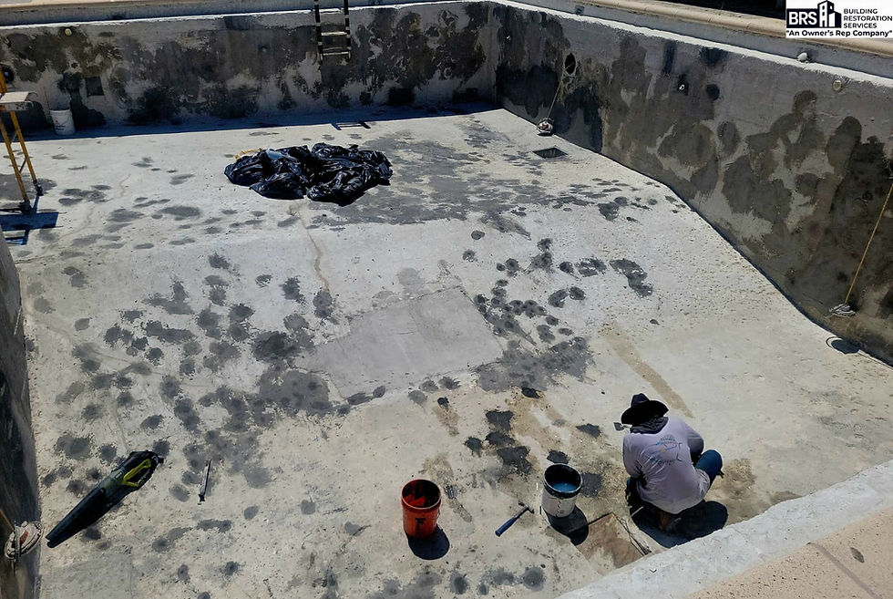 Condominium pool renovation in South Florida during waterproofing and surface preparation work