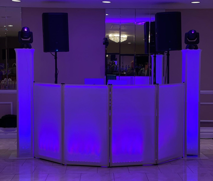 DJ booth and speakers setup with lighting for event. event dj services DJJamesEntertainment