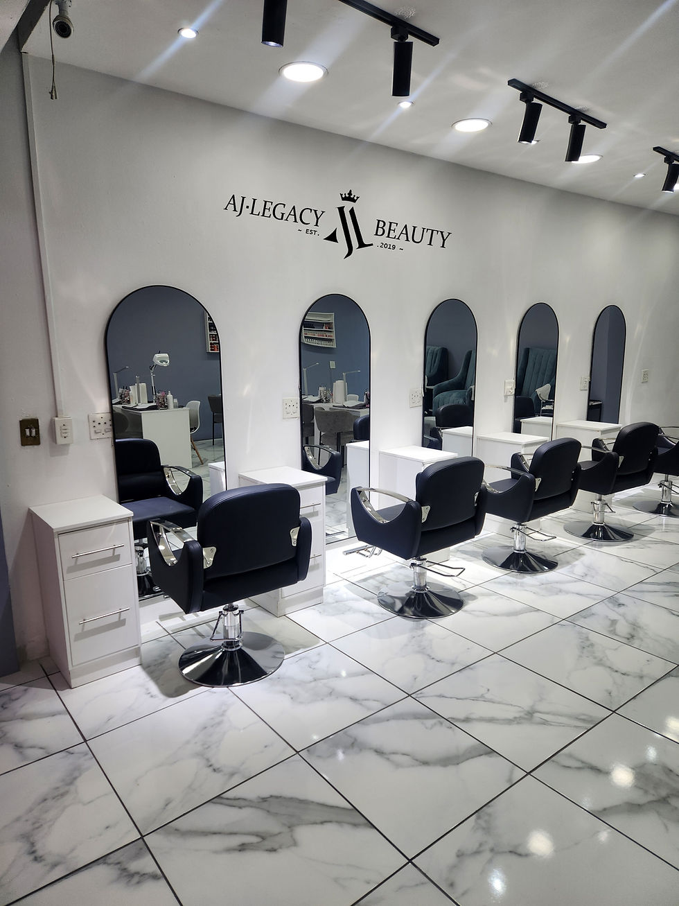 Eye-level view of a modern beauty salon interior with elegant decor and treatment stations