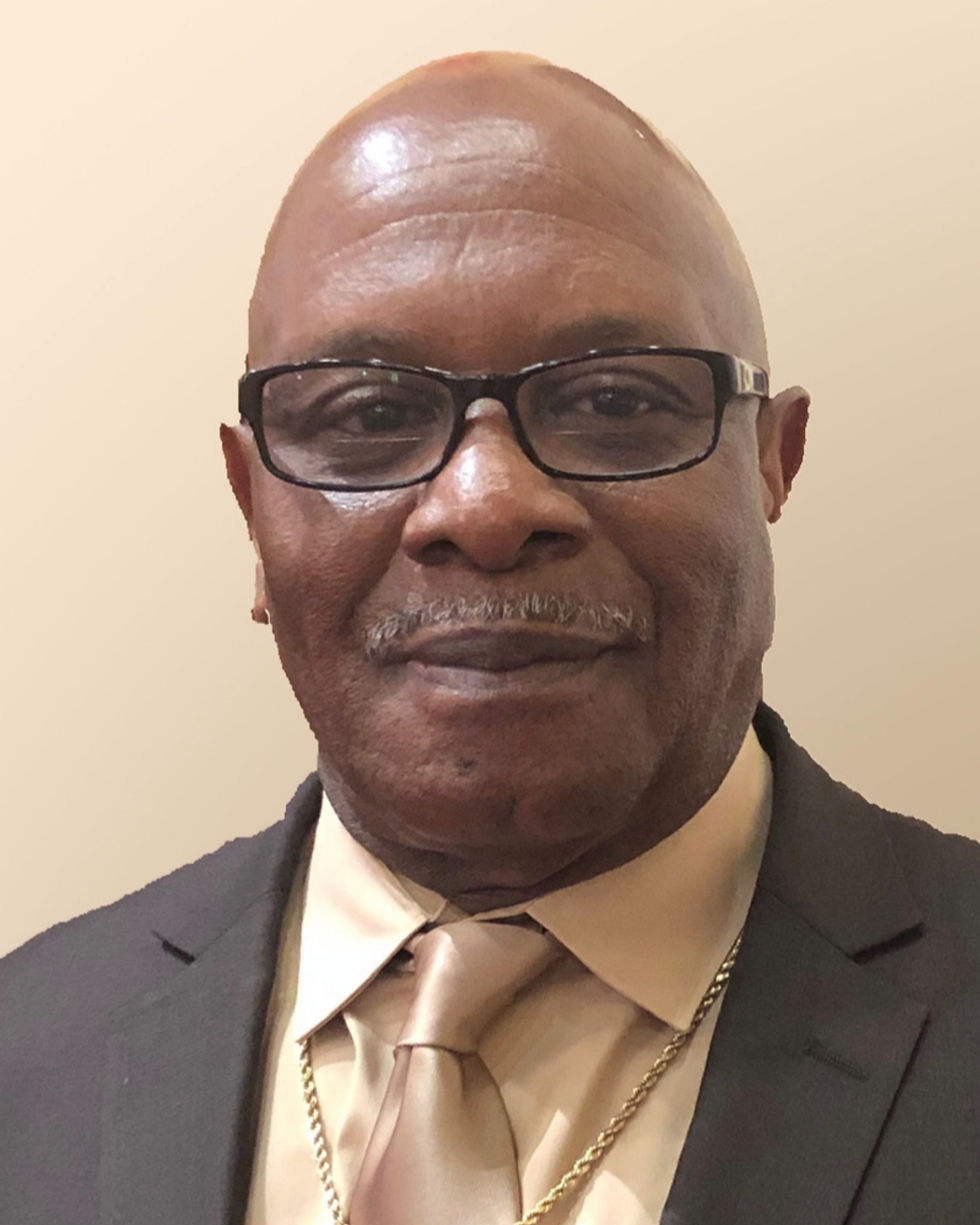 Pastor Ray Houston smiling into the camera.