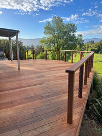 Kwila timber deck with matching kwila balustrade built by Heartland Landscapes in Christchurch, combining durability with a high-quality finish for outdoor living.
