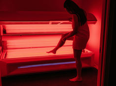 Women getting into Red Light Therapy Pod