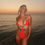 Thumbnail: Woman in red swimsuit at sunset